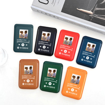 Assorted colors of PU leather MagSafe wallet with custom Spotify code for iPhone