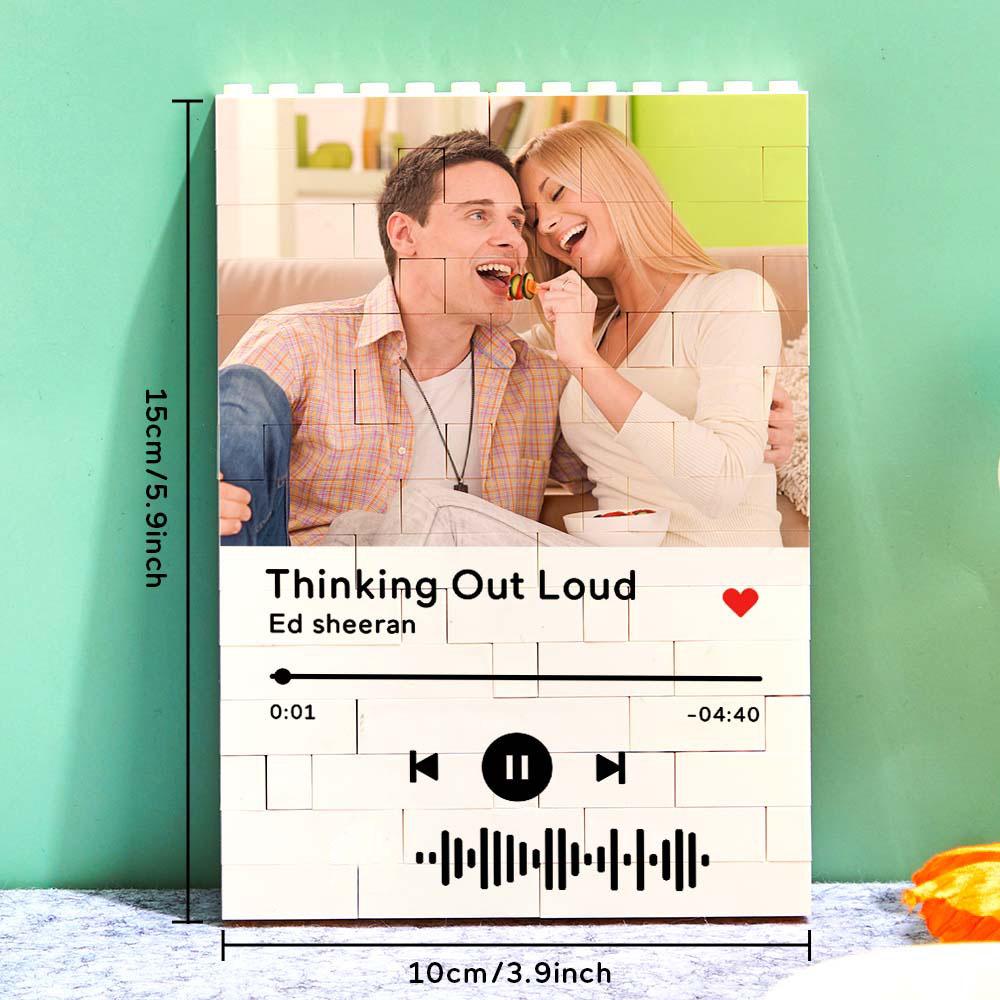 Personalized brick puzzle with couple's photo and music code. A unique gift for anniversaries.