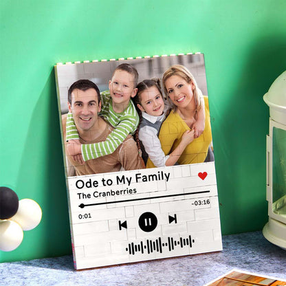 Personalized photo brick puzzle with family portrait and music code. A unique and romantic gift for family.