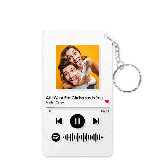 Custom acrylic keychain with photo and scannable music code, a personalized gift.